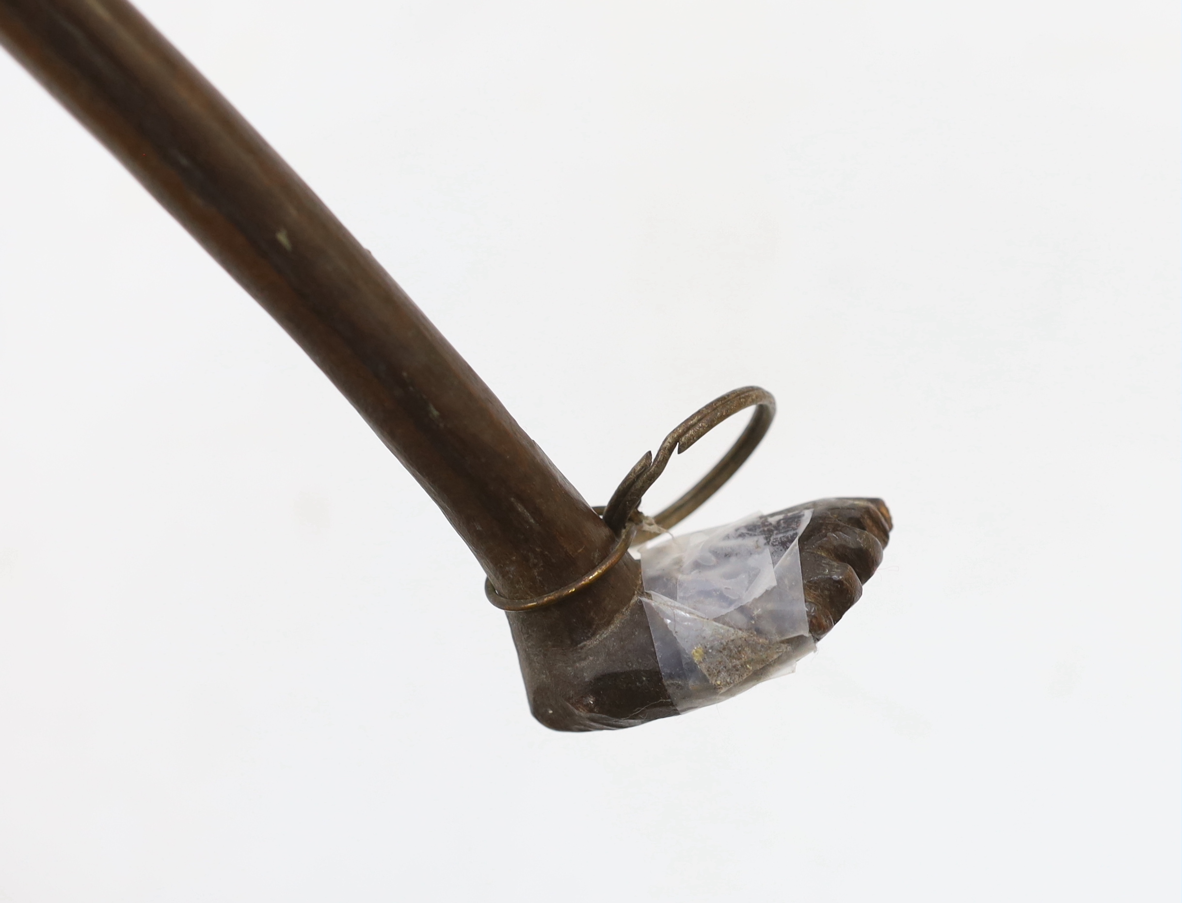 An African carved ebony walking stick, Gogo tribe, Tanzania, with inset eyes, 128cm (damage to foot)
